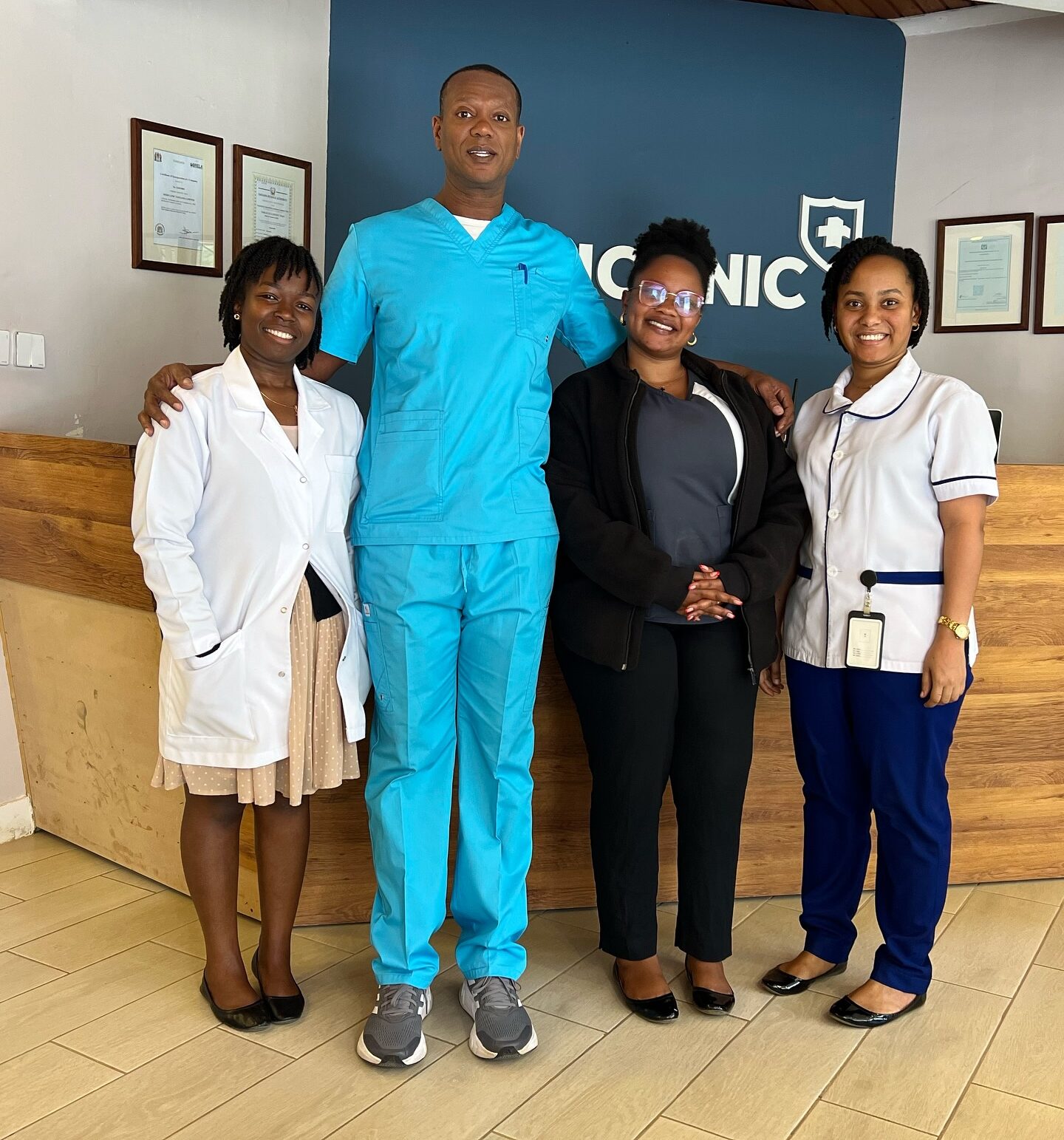Dr. David Howard with clinic staff at medical clinic reception